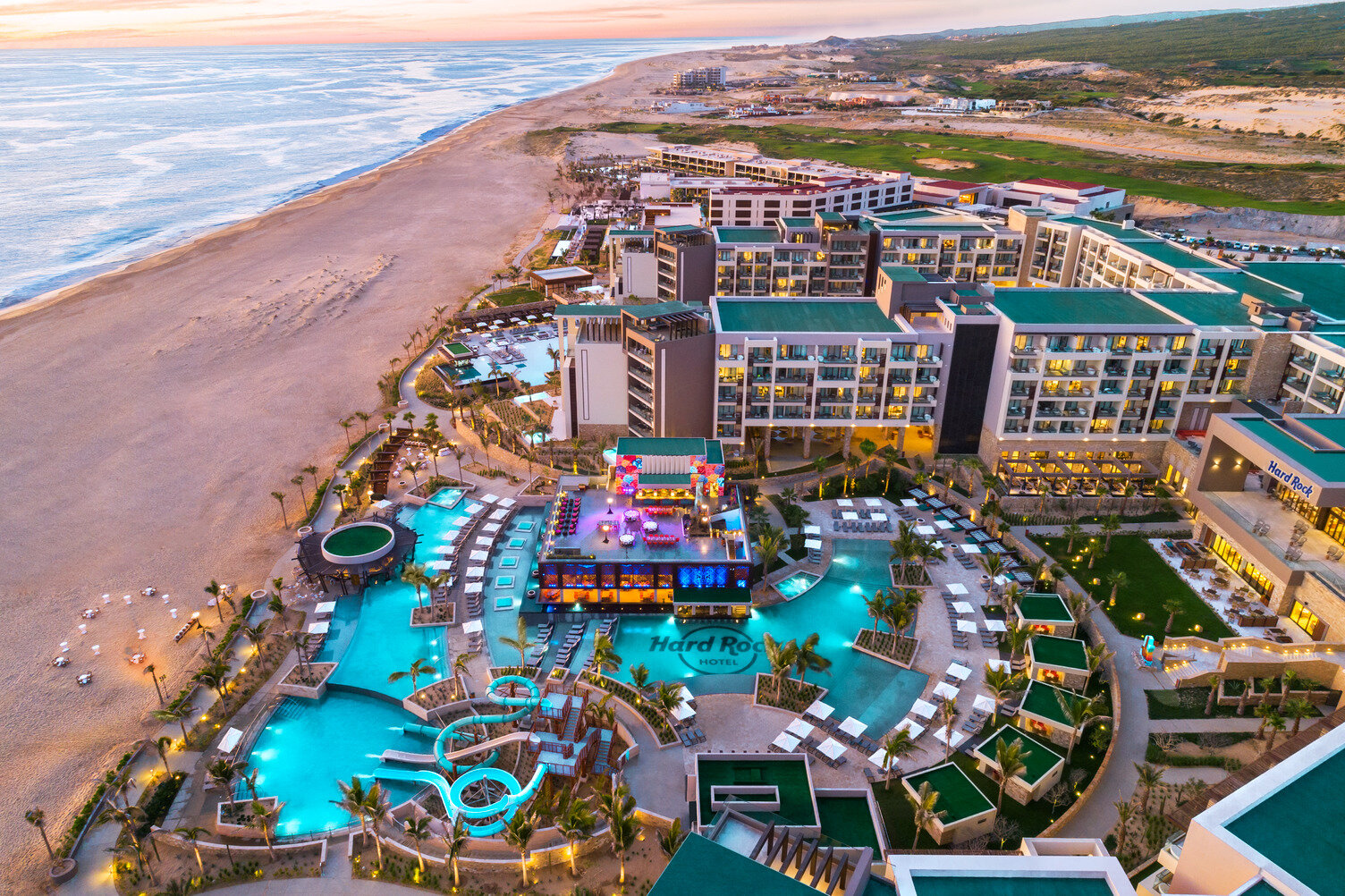 drone footage of the shoreline in front of hard rock hotel los cabos